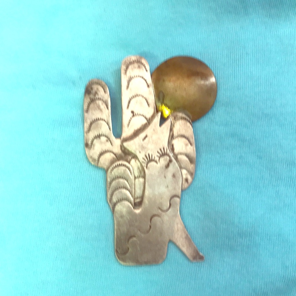 Vintage silver cactus coyote pendant.